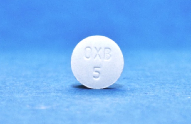 Commande Ditropan - Illustration d’un comprimé de Ditropan et boîte